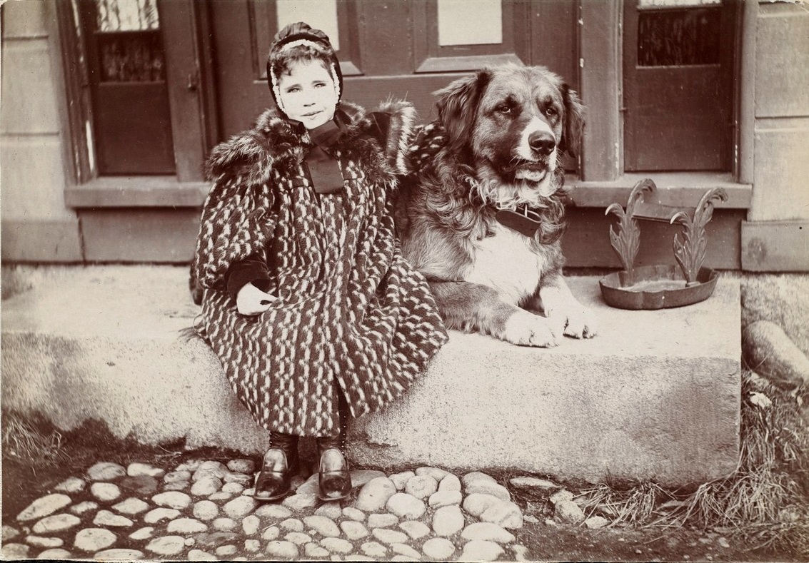 Higgins Girl seated with dog