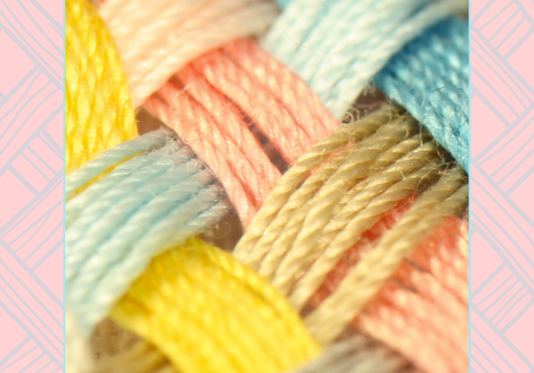 A photograph of yarn in a basket weave formation.